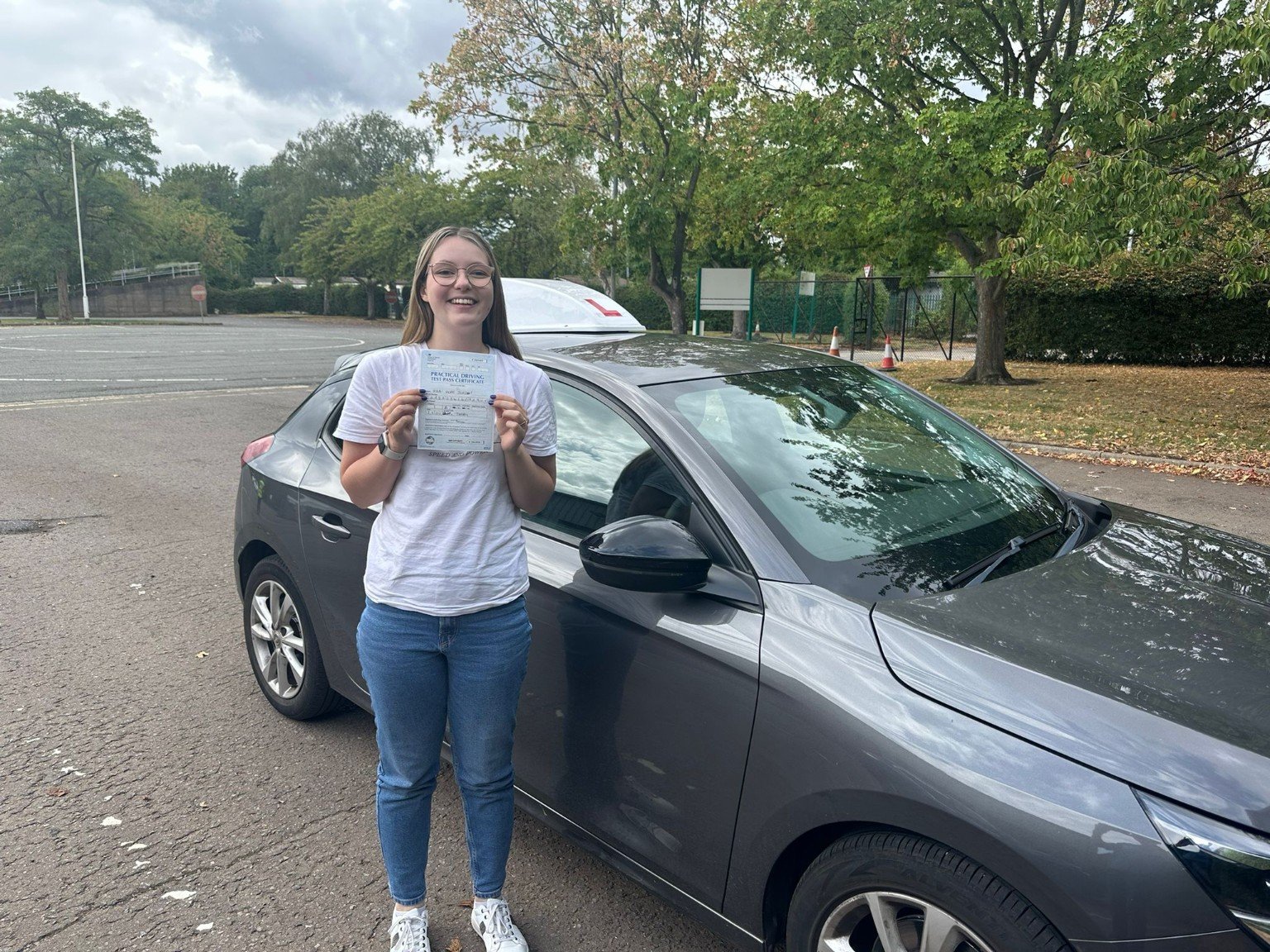 Abbi celebrating her driving test pass at Derby