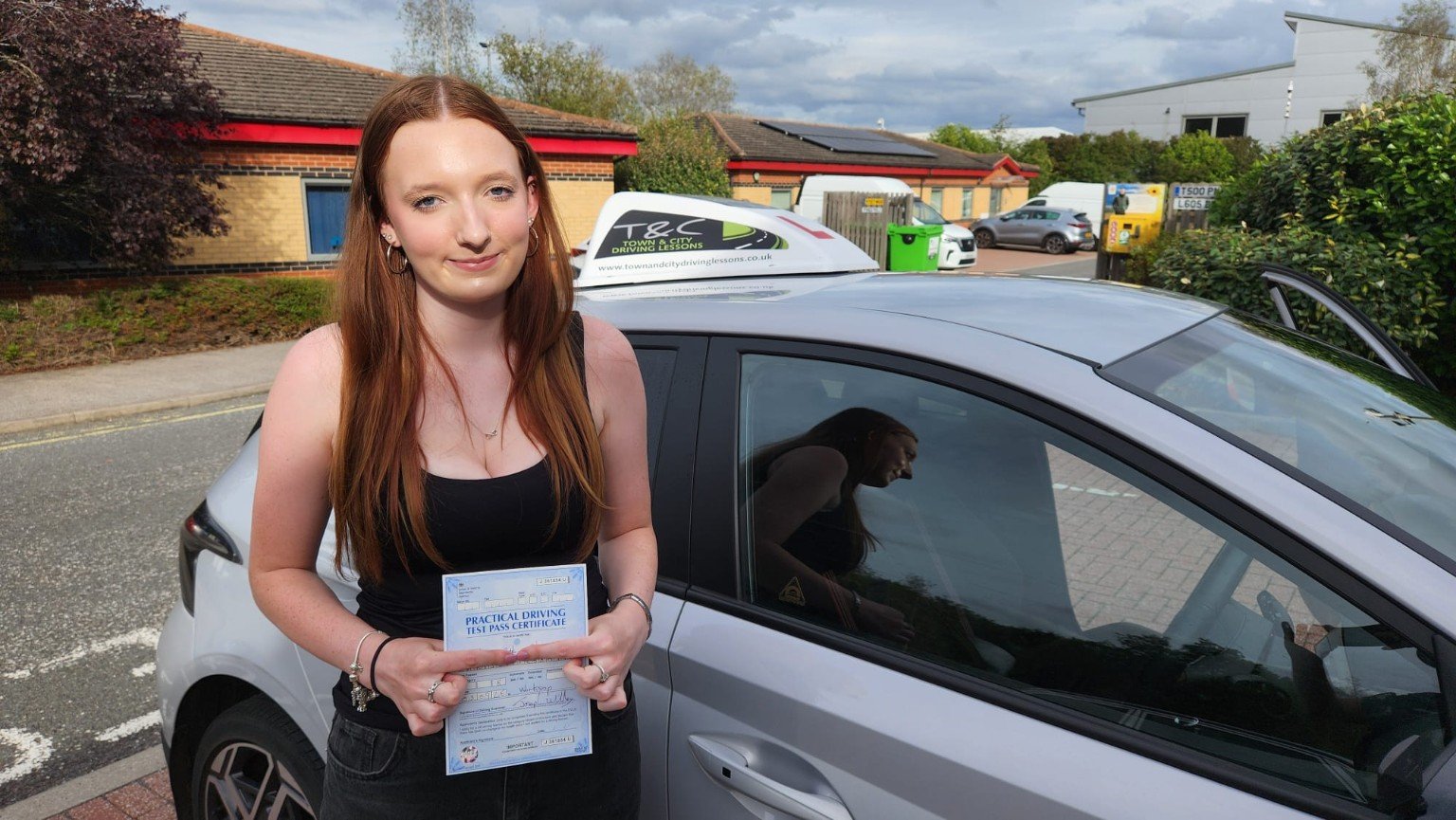 Beth celebrating her driving test pass at Worksop