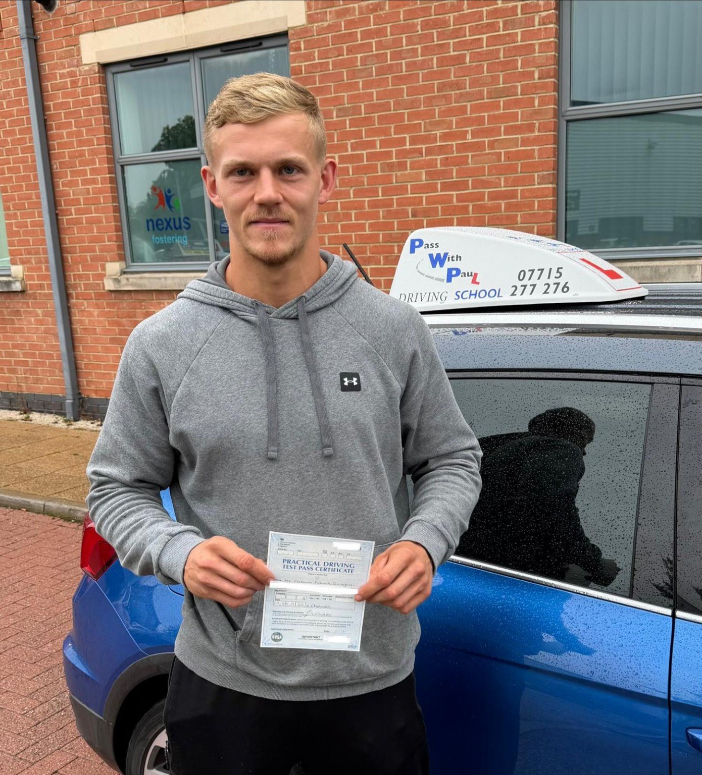 Callum celebrating his driving test pass at Chilwell