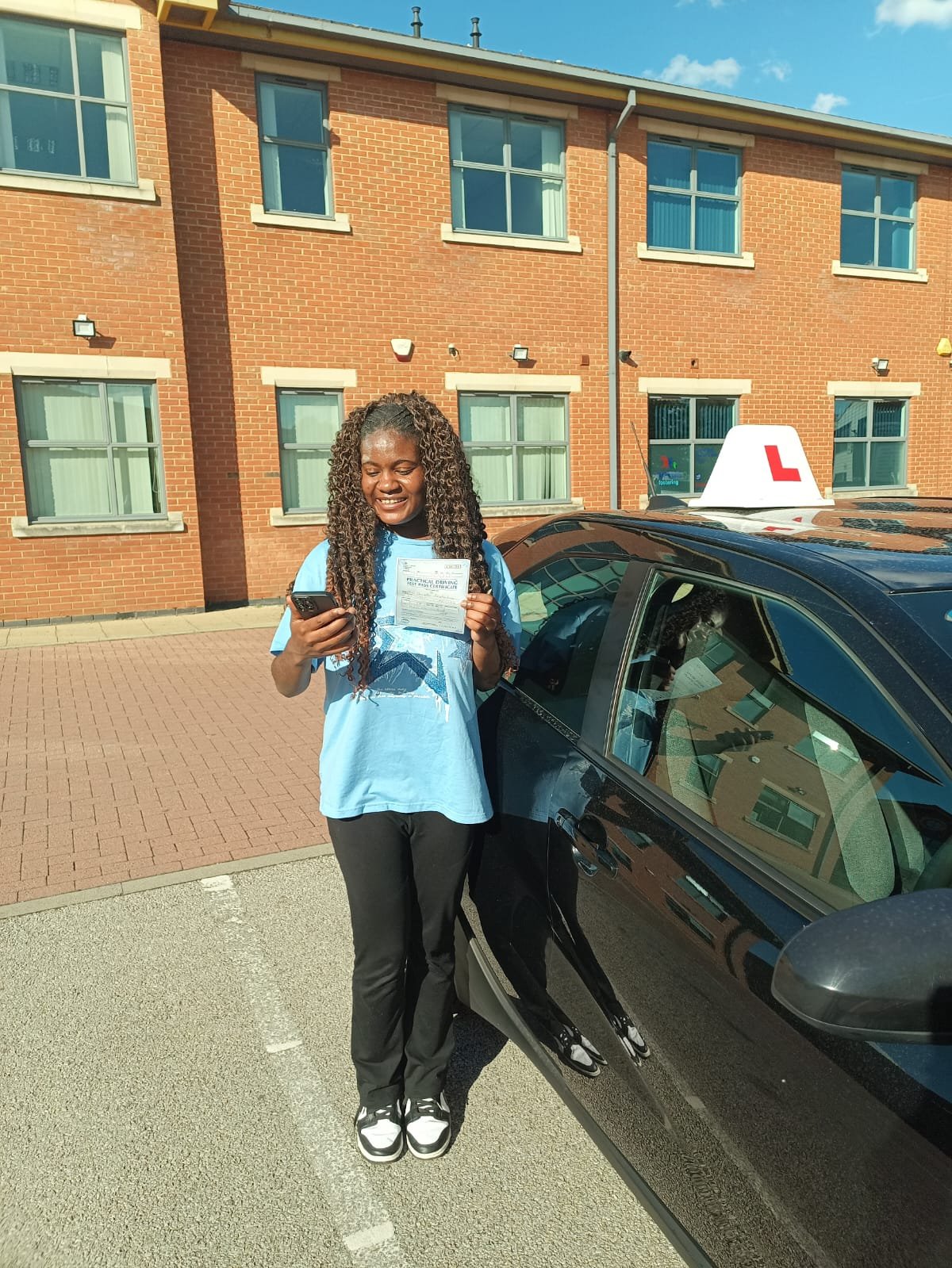 Danielle celebrating her driving test pass at Chilwell