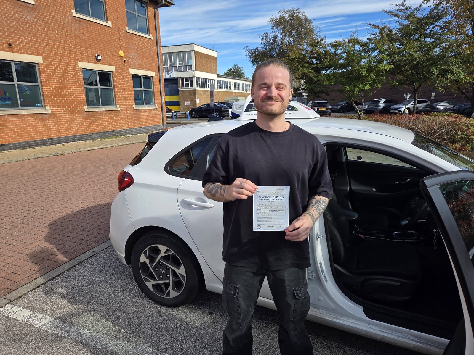Rob celebrating his driving test pass at Chilwell